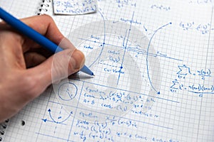 Math exercize in white notebook closeup