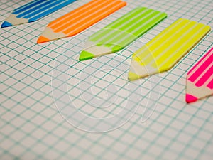 Math notebook and stickers crayon shape business concept with copy space