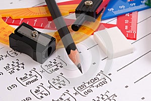Math quadratic equation concepts. School supplies used in math. Math drawing tools with math equipment. photo