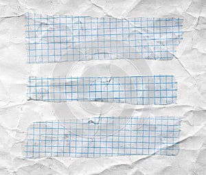 Math torn papers isolated on wrinkled white paper sheet