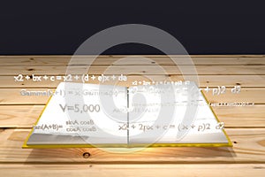 Mathematical equation float up on a white book and yellow cover