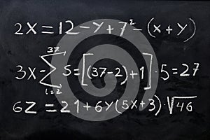 Mathematical equations written on a blackboard photo