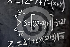 Mathematical equations written on a blackboard photo