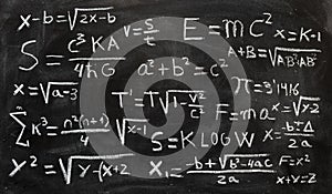 Mathematical equations and physics formulas handwritten on blackboard photo