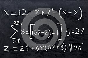 Mathematical equations written on a blackboard photo