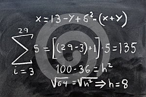 Mathematical equations written on a blackboard photo