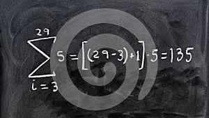 Mathematical equations written on a blackboard photo