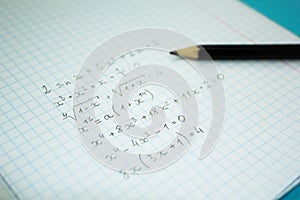 Mathematical examples and calculations in a notebook for lectures photo