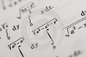 Mathematical Formulas and Equations in Textbooks Featuring Integrals, Square Roots, and Parametric Functions photo