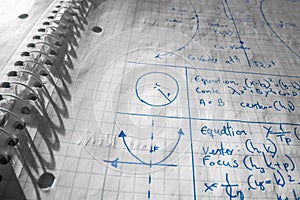 Mathematical formulas written in notebook closeup photo