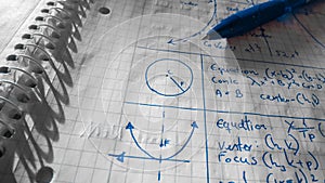 Mathematical formulas written in notebook closeup photo