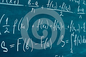 Mathematics formulas written on the blackboard. School, education, integral. photo