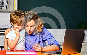 Mathematics for kids. Little boy studying, doing homework with mother. Female teacher giving private lessons to kid at