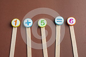 Mathematics Toy Numbers on Brown Background.
