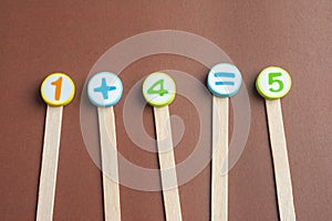 Mathematics Toy Numbers on Brown Background.