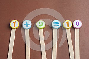 Mathematics Toy Numbers on Brown Background.