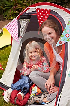 Mather And Daughter Enjoying Camping Holiday On Campsite