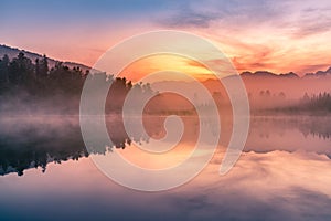 Matheson lake with reflection with beauty sunrise sky  background, New Zealand