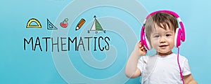 Mathmatics with toddler boy with headphones