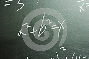 Maths formulas on chalkboard background