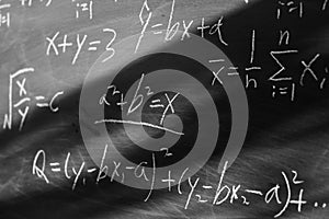 Maths formulas on chalkboard background