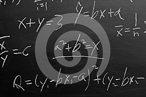 Maths formulas on chalkboard background