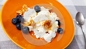 Mato cheese with honey walnuts and blueberries photo