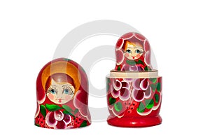 Matreshka Russian doll souvenir bright red, purple and green flowers pattern on white background isolated closeup