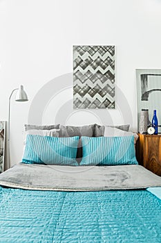 Matrimonial bed with blue bedding