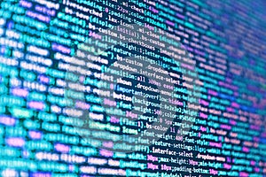 Matrix byte of binary data rian code running abstract background in dark blue digital style. Writing programming code on laptop.