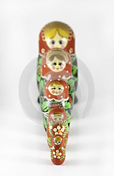 Matryoshka dolls arranged in a straight vertical line