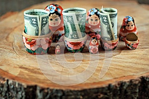 Matryoshka. Russian doll with dollars. Anti crisis money box.