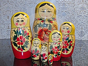 Matryoshka-Russian folding doll made of wood, inside which there are dolls of smaller size. Semenovskaya matryoshka