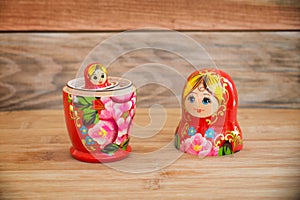 Matryoshkas, russian nesting dolls on wood background, mother, daughter and family concept