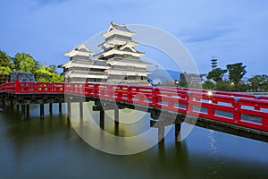 Matsumoto castle and red bridgein night, Nagono, Japan