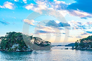 Matsushima Bay in dusk, beautiful islands covered with pine trees and rocks photo