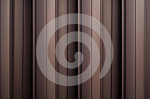 Matte brown metal wall siding background. Metal convex texture. Light brown striped surface. Abstract ribbed backgrounds