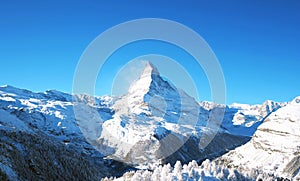 The Matterhorn mountain, scenic view on snowy landscape in winter, Switzerland