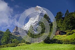 Matterhorn and old hut in summer day