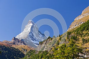 The Matterhorn  peak and mountain range view from Zermatt Switzerland in summer and blue sky background