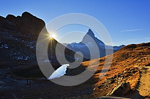 Matterhorn peak reflected in Riffelsee at sunset