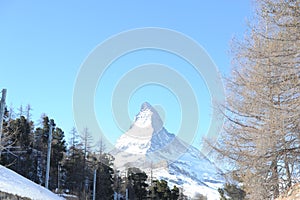 Matterhorn peak in Zermatt in winter with snow and blue sky on a sunny day in the Alps, Switzerland