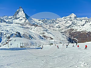 Matterhorn with some skiers skiing