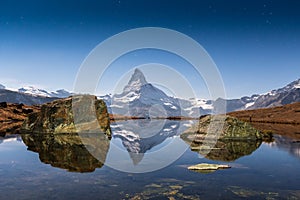 Matterhorn und Stellisee in Mondlicht photo