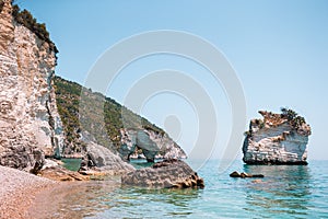 Mattinata Faraglioni stacks and beach coast of Mergoli, Vieste Gargano, Apulia, Italy.