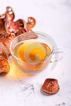 Matum thai tea. Bael fruit tea and slices of dried bael fruit