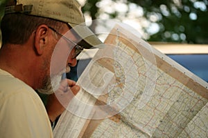 Mature adult man looking at map
