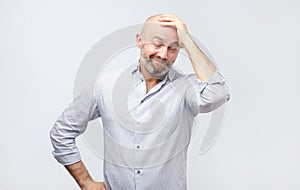 Mature adult in white shirt having a doubt. I am confused and do not know the right way concept