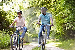 Mature African American Couple On Cycle Ride In Countryside photo