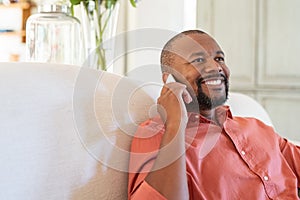 Mature african man talking on smartphone
